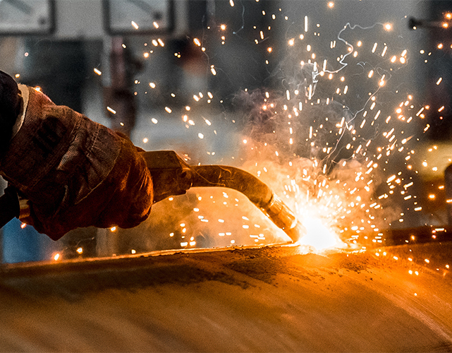 man welds at the factory